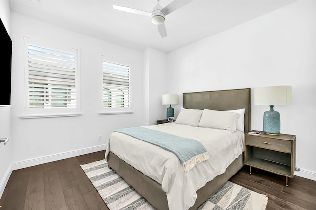 bedroom with ceiling fan and dark hardwood / wood-style flooring