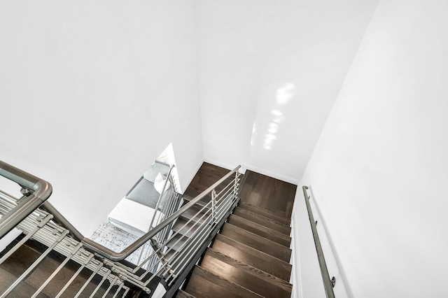 stairs featuring wood-type flooring