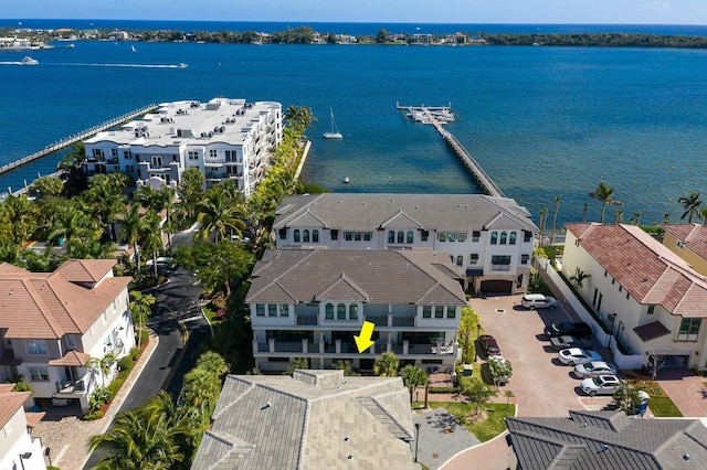 birds eye view of property featuring a water view and a residential view