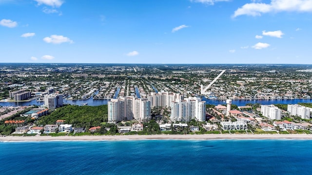 aerial view with a water view and a beach view