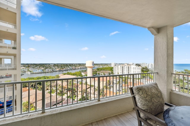 balcony featuring a water view