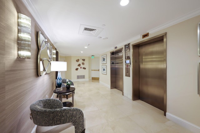 hall featuring elevator and ornamental molding