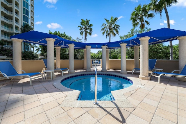 view of swimming pool featuring a patio area