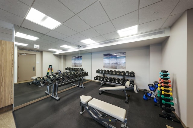 exercise room with a paneled ceiling