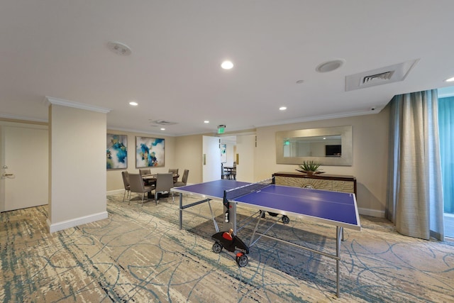 recreation room with light carpet and crown molding