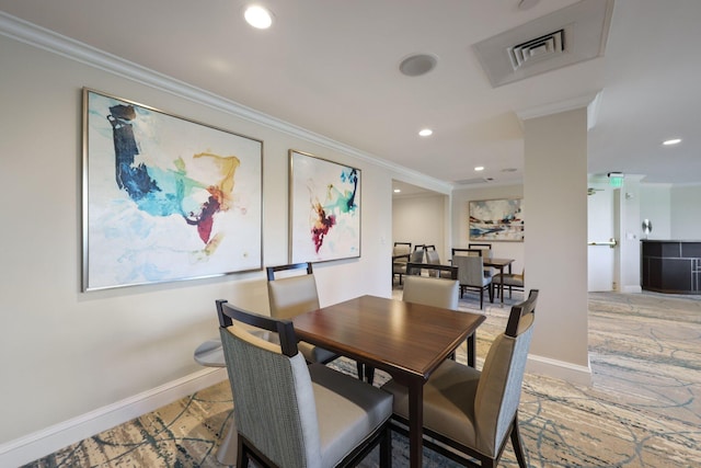 dining area featuring crown molding