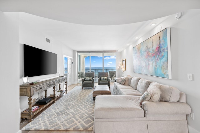 living room featuring floor to ceiling windows