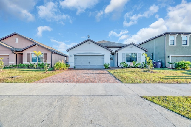 ranch-style house featuring a front lawn and a garage