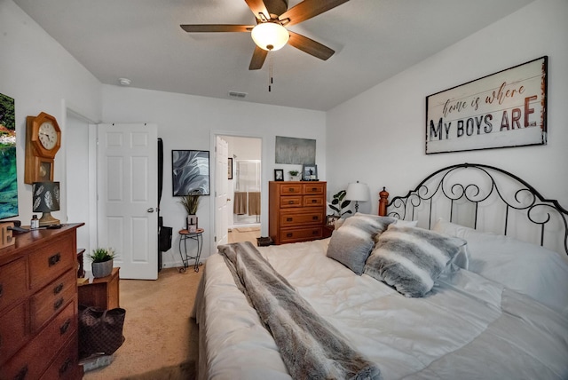 carpeted bedroom with ceiling fan and connected bathroom