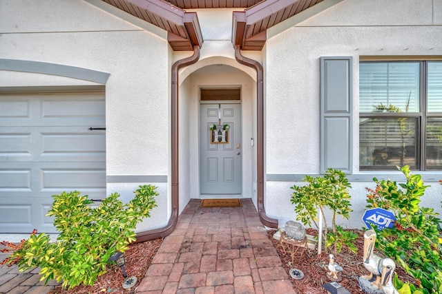 doorway to property featuring a garage