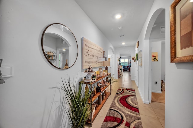 hallway featuring light tile patterned flooring