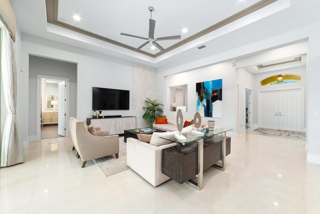 10176 Calabrese Trl, Jupiter, FL 33478 - living room with a tray ceiling, ceiling fan, light tile patterned flooring, and recessed lighting
