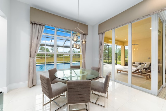 10176 Calabrese Trl, Jupiter, FL 33478 - dining space with light tile patterned flooring and a chandelier
