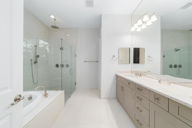 bathroom featuring vanity, independent shower and bath, and tile patterned flooring