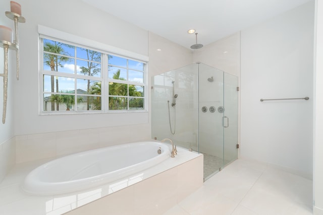 bathroom featuring independent shower and bath and tile patterned floors