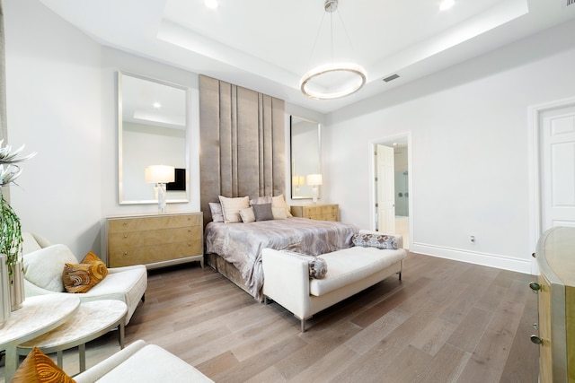 10176 Calabrese Trl, Jupiter, FL 33478 - bedroom with a raised ceiling, light wood-style flooring, and recessed lighting