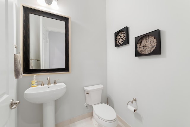 bathroom featuring tile patterned floors and toilet