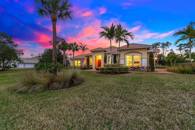 10176 Calabrese Trl, Jupiter, FL 33478 - mediterranean / spanish house with stucco siding and a front lawn