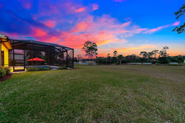 yard at dusk with glass enclosure