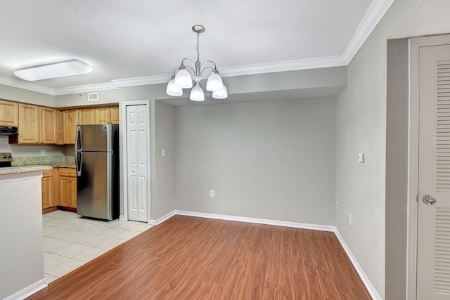 15155 Michelangelo Blvd Unit 201, Delray Beach, FL 33446 - kitchen featuring light wood finished floors, stainless steel appliances, a chandelier, crown molding, and light countertops