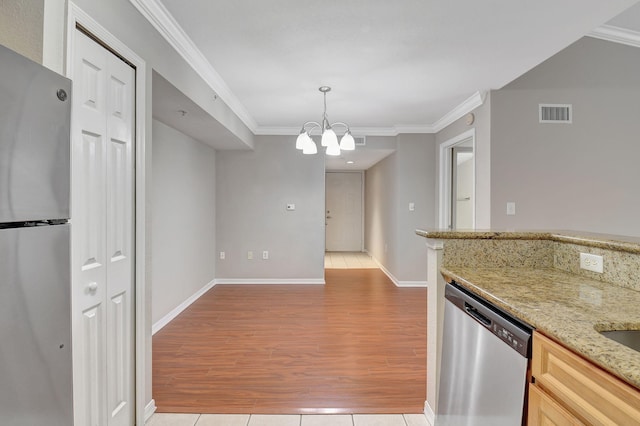 15155 Michelangelo Blvd Unit 201, Delray Beach, FL 33446 - kitchen with crown molding, light wood finished floors, a notable chandelier, and stainless steel appliances