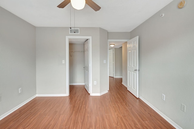 unfurnished room with ceiling fan and light hardwood / wood-style flooring