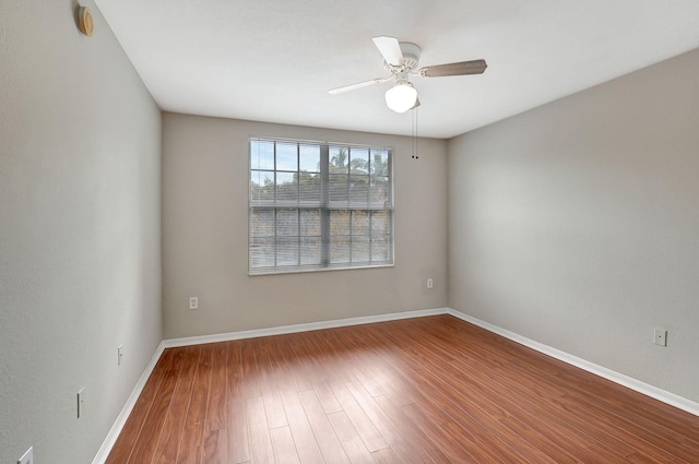 15155 Michelangelo Blvd Unit 201, Delray Beach, FL 33446 - empty room featuring baseboards, a ceiling fan, and wood finished floors