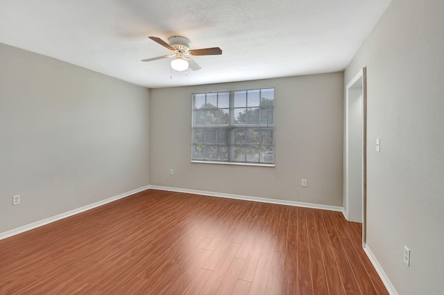 15155 Michelangelo Blvd Unit 201, Delray Beach, FL 33446 - spare room with baseboards, a ceiling fan, and wood finished floors