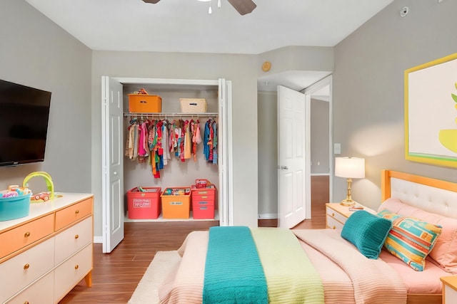15155 Michelangelo Blvd Unit 201, Delray Beach, FL 33446 - bedroom featuring a closet, baseboards, a ceiling fan, and wood finished floors