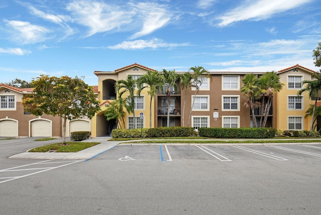 15155 Michelangelo Blvd Unit 201, Delray Beach, FL 33446 - view of property featuring uncovered parking