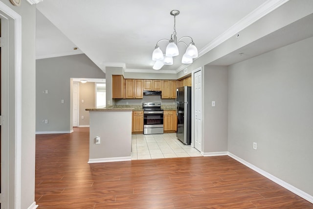 15155 Michelangelo Blvd Unit 201, Delray Beach, FL 33446 - kitchen with crown molding, freestanding refrigerator, a chandelier, and stainless steel electric range