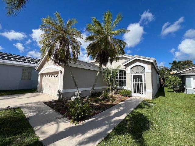 view of front facade featuring a front yard and a garage