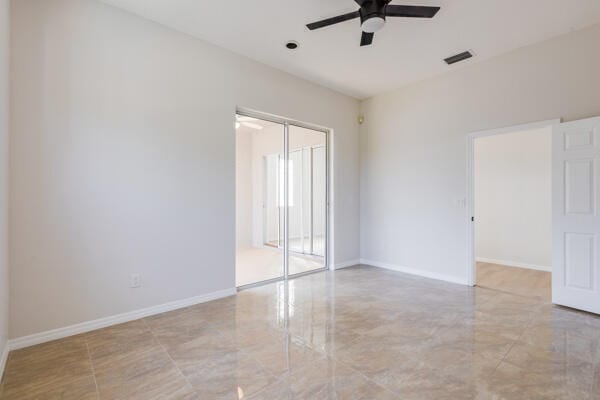 spare room with ceiling fan