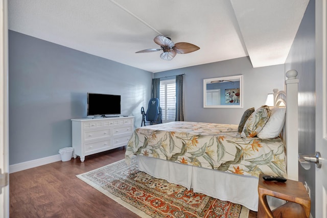 bedroom with ceiling fan and dark hardwood / wood-style flooring