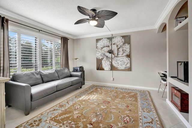 tiled living room with ceiling fan, a textured ceiling, and crown molding