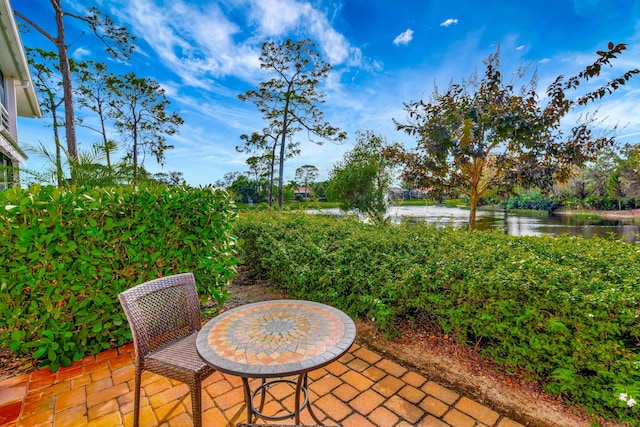 view of patio / terrace with a water view