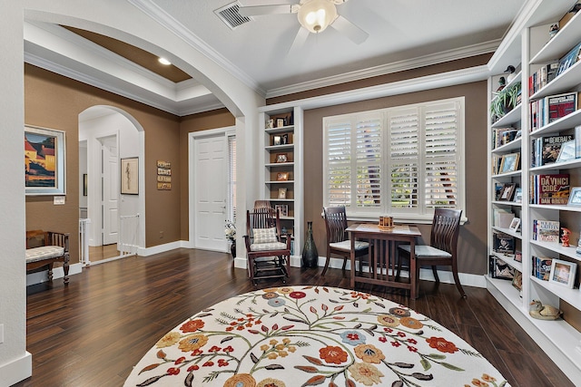 living area with ornamental molding, ceiling fan, and dark hardwood / wood-style flooring