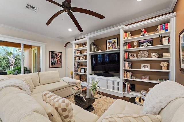 living room featuring crown molding, ceiling fan, and hardwood / wood-style flooring