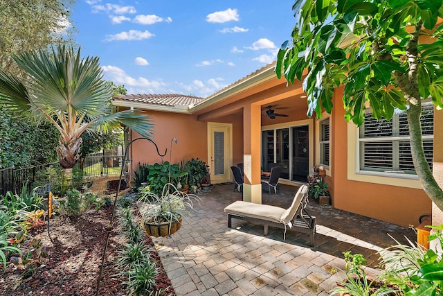 view of patio featuring ceiling fan