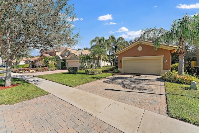 single story home featuring a garage and a front lawn