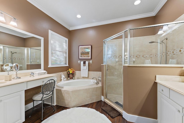 bathroom with vanity, hardwood / wood-style flooring, and shower with separate bathtub