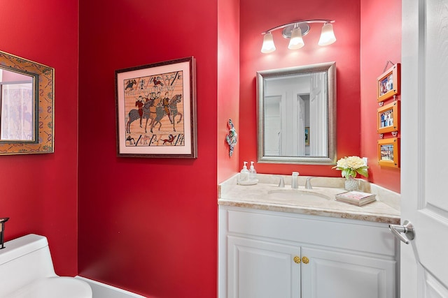 bathroom with vanity and toilet