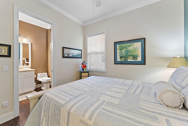 bedroom with crown molding, dark wood-type flooring, and ensuite bath