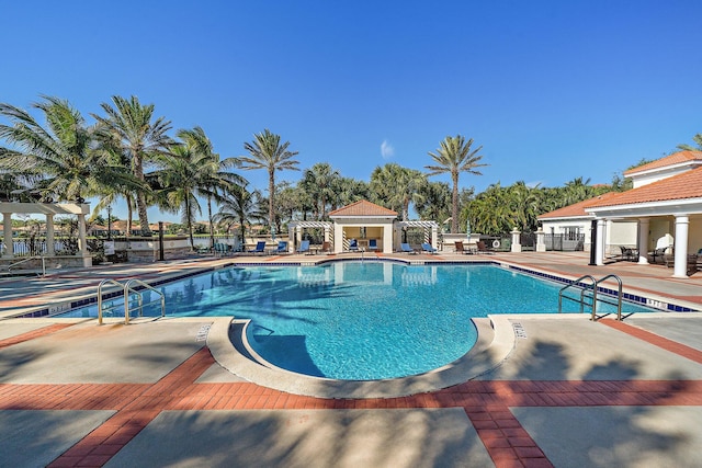 view of swimming pool with a pergola and a patio area