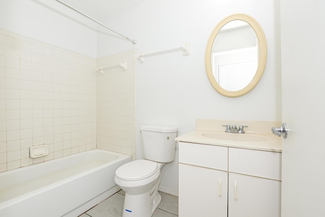 full bathroom featuring tiled shower / bath, tile patterned flooring, vanity, and toilet