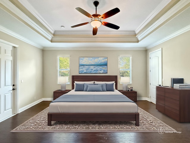 bedroom with ornamental molding, a raised ceiling, and ceiling fan