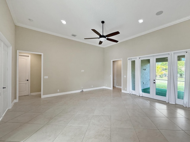 empty room featuring light tile patterned floors, ceiling fan, french doors, and crown molding