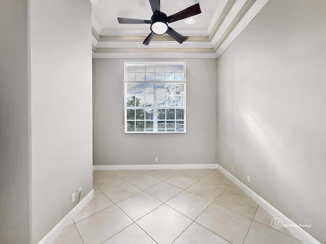 spare room featuring crown molding, ceiling fan, a tray ceiling, and light tile patterned floors