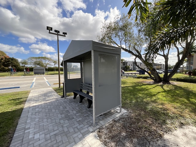 view of outdoor structure featuring a lawn