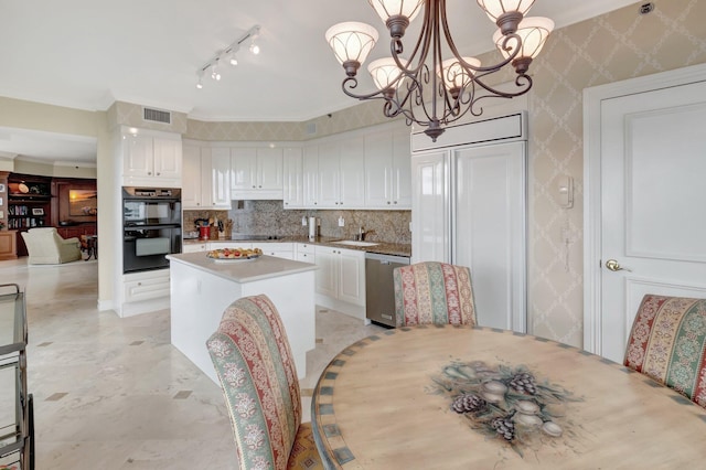 kitchen featuring hanging light fixtures, a chandelier, black appliances, white cabinets, and a center island